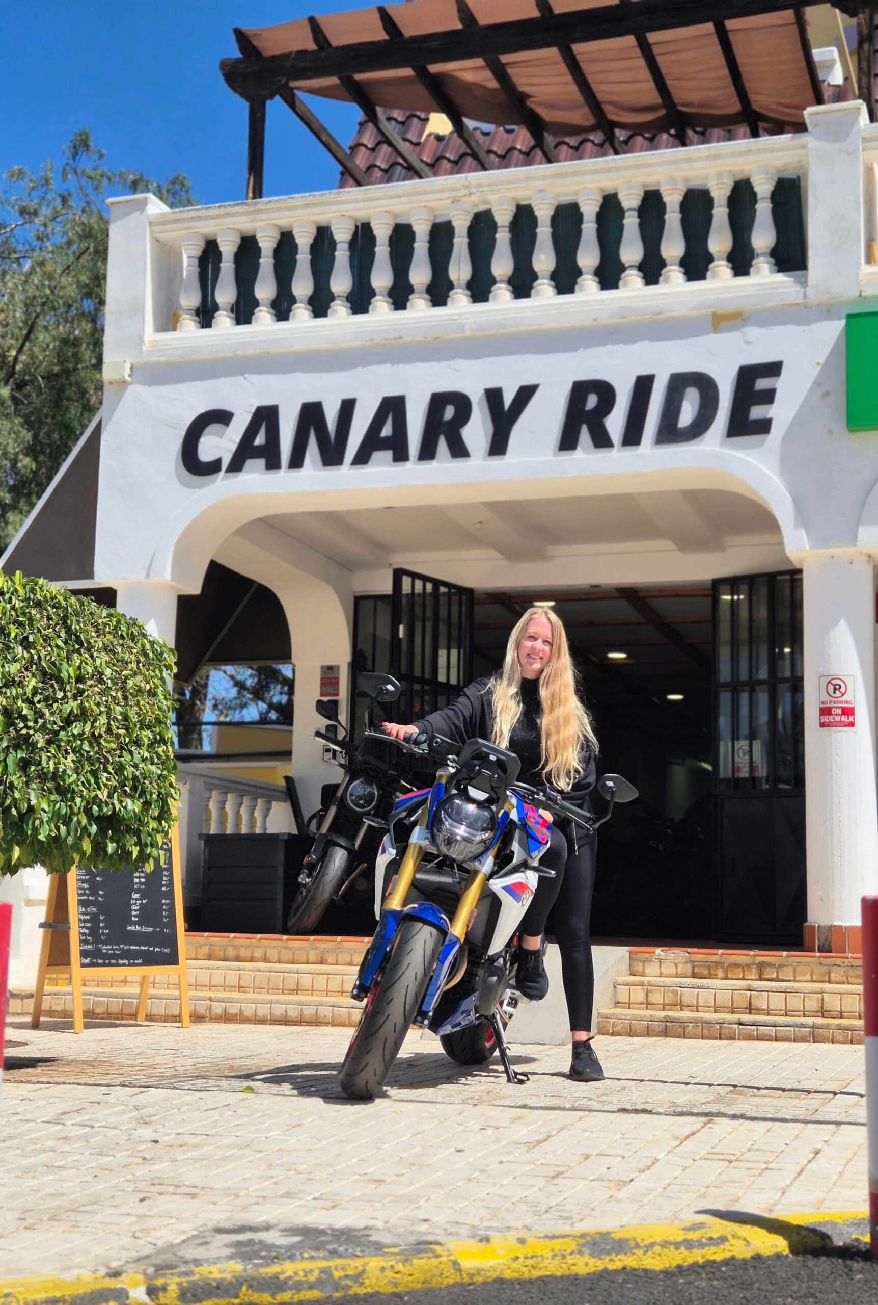 Customer collecting a motorcycle outside the Canary Ride base